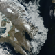 Satellite image of Canada’s Baffin Island. The Barnes Ice Cap is the elliptical ice sheet in the center of the island in the upper left. Image: NASA Earth Observatory